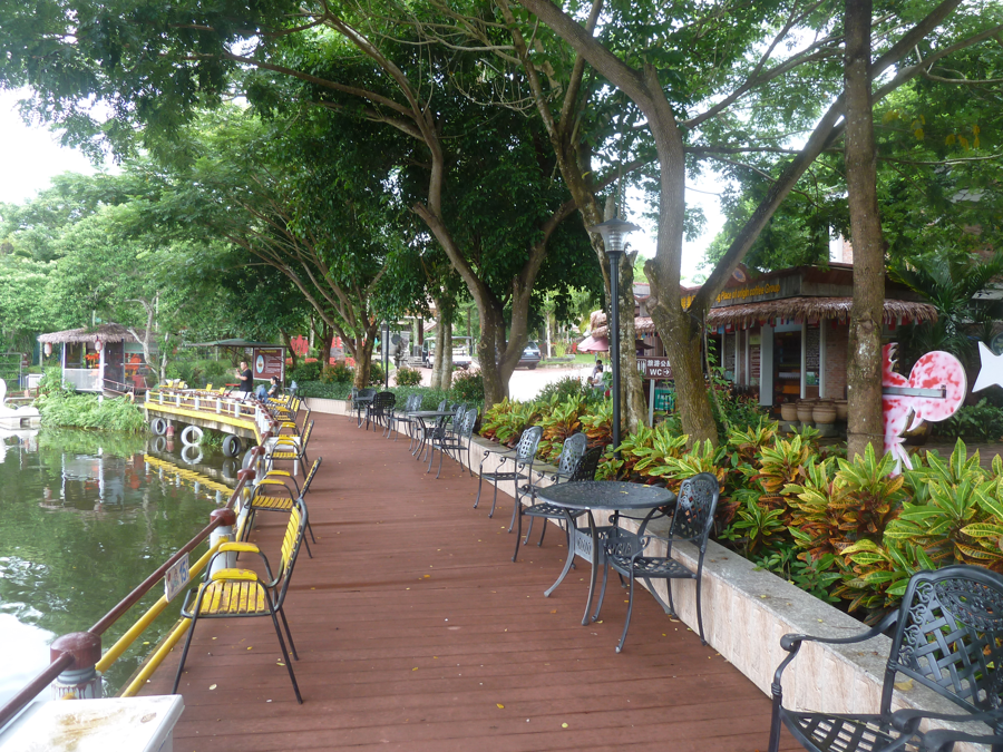 Shaded lakeside terrace at Xinglong Coffee Valley, Wanning
